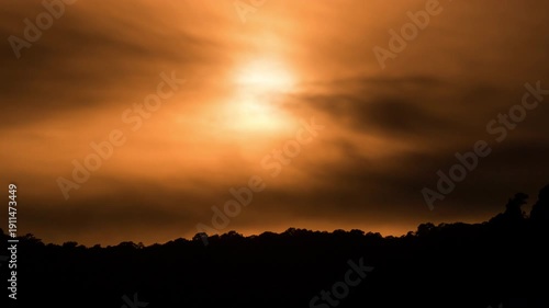 Mountain sunset time-lapse with flowing mist and golden hour light hitting the ridges.