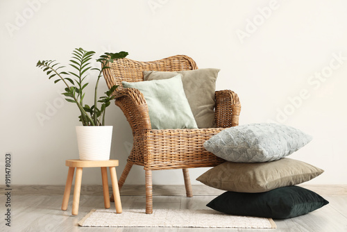 Wicker armchair with decora...