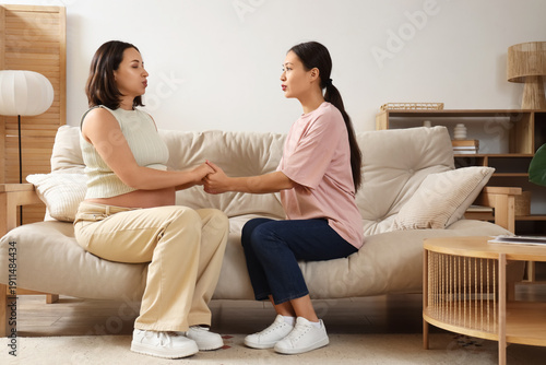 Young pregnant woman doing ...