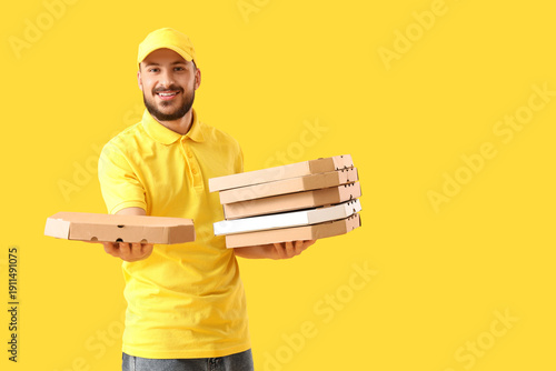 Male courier with pizza box...
