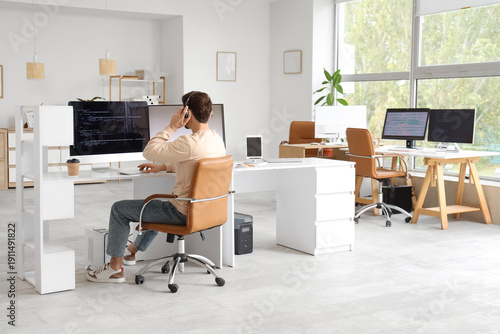Male programmer working in ...