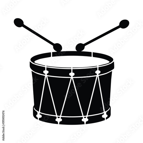 Drum with drumsticks in striking position on snare drum