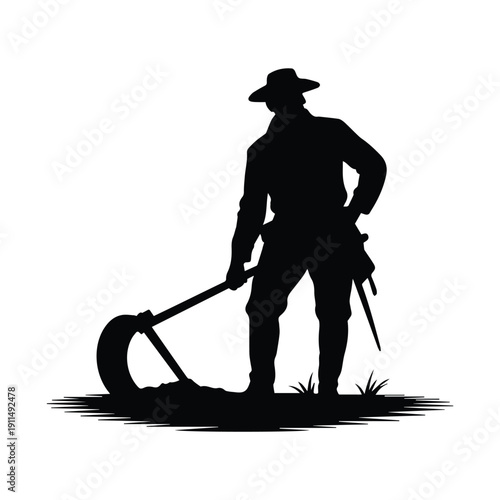 Man in silhouette working outdoors with farm tool