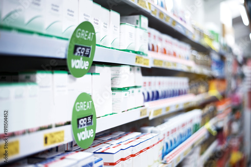 Pharmacy, sale and medicine on shelf in store for prescription, vitamins or supplements deal. Healthcare, dispensary and aisle of medication, tablets or pills for discount, medical product or bargain
