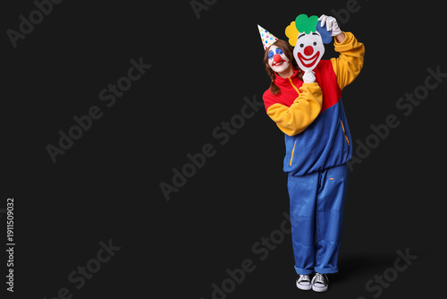 Young happy woman dressed a...