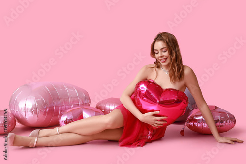 Young woman with heart-shap...
