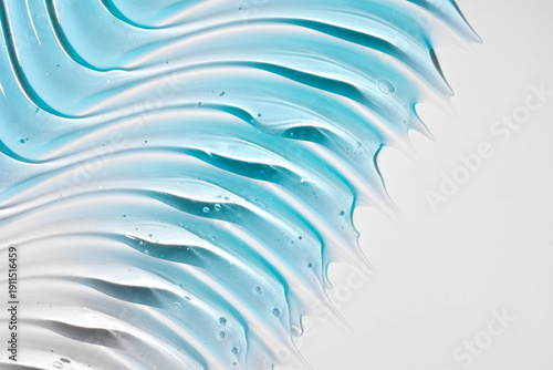 blue serum gel sample swatch texture background. Cosmetic Hyaluronic acid retinol collagen science lab product