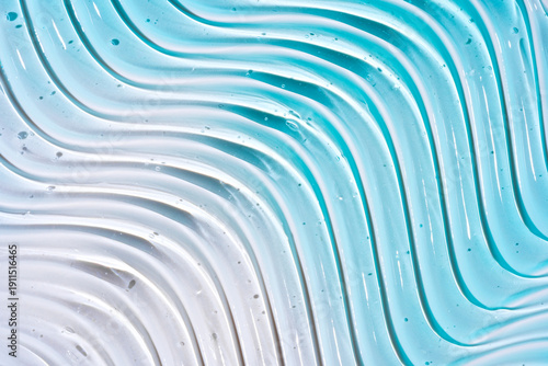 Close-up image displaying blue pure gel texture with glossy highlights and clear droplets, ideal for background use