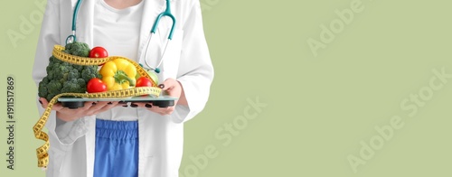 Female nutritionist holding...