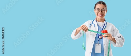 Female nutritionist holding...