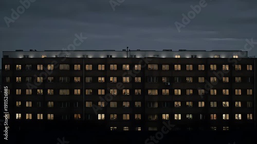 apartment block at night with lit windows