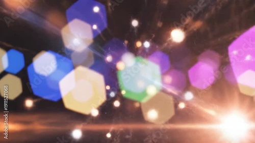 Abstract sparkle explosion with colorful hexagonal bokeh lights