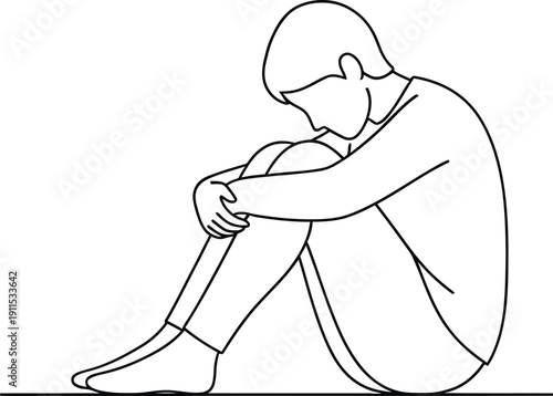 Sad person sitting alone feeling depressed and isolated