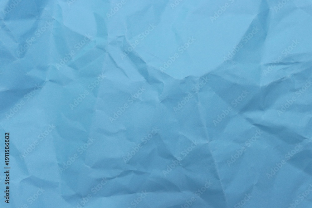 Obraz premium Wrinkled blue craft paper pattern background