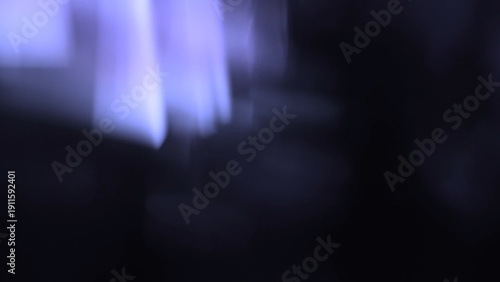 Dark purple blurred light leaks with glow, overlay, lens flare effects. Vintage film style, cinematic, analog texture. Background, digital art, cinematic visuals, retro fantasy, creative banner.