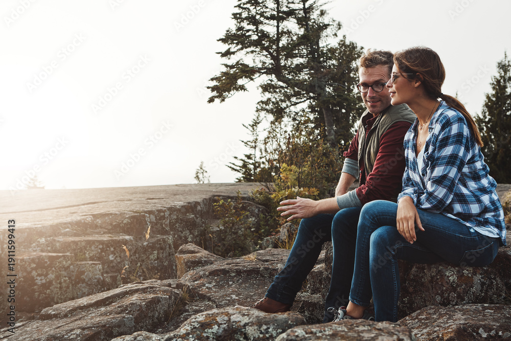 Fototapeta premium Thinking, couple and smile for hiking on mountain with vision, trekking and bonding together. Space, people and relax on cliff for reflection outdoor, fresh air and daydreaming with nature view
