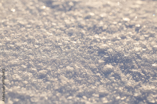 Fotografie background of fresh snow texture in sun tone