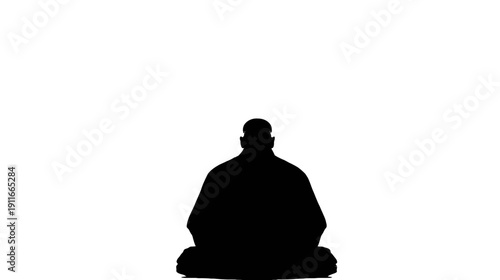 A silhouette of a person in a seated position, head and shoulders visible, meditating