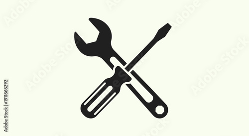 Crossed Wrench and Screwdriver Silhouette.