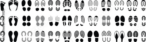 Collection of black footprint and shoe sole silhouettes isolated on white background showing human footsteps, walking tracks and shoe tread patterns, minimalist vector illustration set