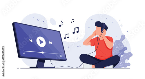 Young man sitting on the floor with headphones on to listen to music or watch videos on a large computer monitor in a relaxed home environment.