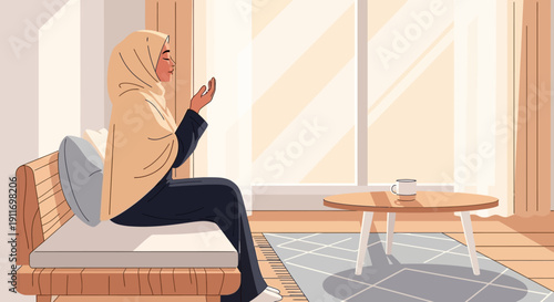 Young Muslim Woman in Hijab Praying at Home by Window with Sunlight