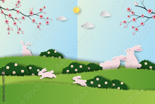 Easter's day greeting card,Blooming flowers with cute rabbits family on spring garden