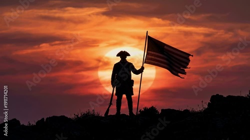 Silhouette of an American revolutionary soldier holding a flag at sunset. Colonial patriot with a musket standing on a hill during the war for independence. USA history concept
