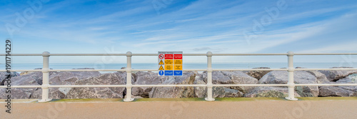 Danger! Danger! A warning sign on a sea wall