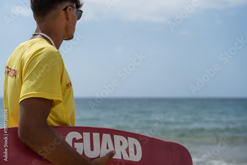 Cuadro en lienzo Lifeguard watching over swimmers on a sunny day