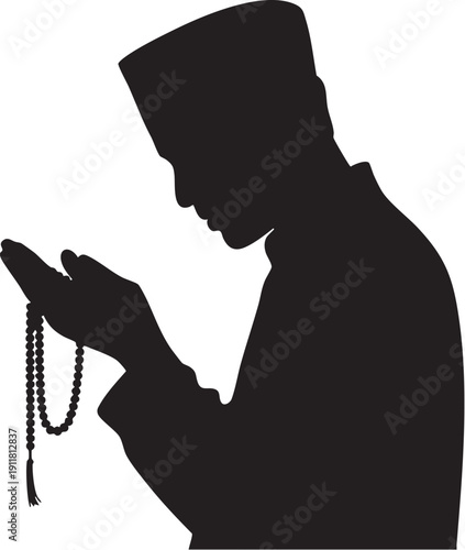 Silhouette man praying holding prayer beads, facing away