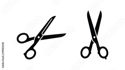 Two pairs of open scissors depicted in a stark black silhouette