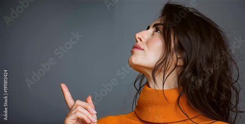 Wallpaper Mural Thoughtful Young Woman Pointing Up with Finger – Idea and Inspiration Concept on Gray Background Torontodigital.ca
