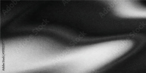 A dark and textured black and white silk fabric surface with a smooth satin pattern creates a gray grunge material backdrop for a fashion wallpaper design