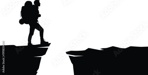 Man with backpack standing on cliff edge looking ahead into vast open space