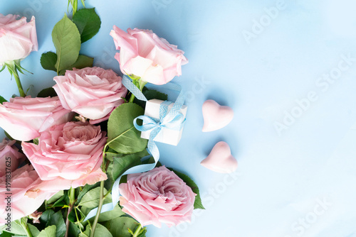 Blooming pink rose flowers bouquet with gift box, Valentine's Day background