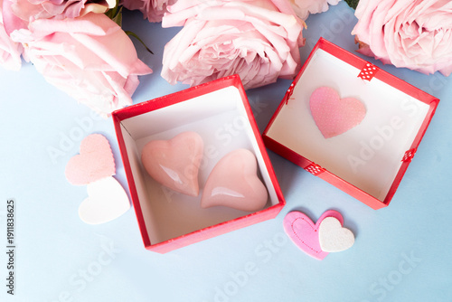 Blooming pink rose flowers bouquet with gift box, Valentine's Day background