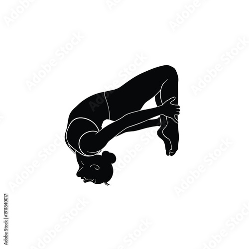 Woman performing a yoga pose with flexibility and strength in a serene environment, viewed from the side