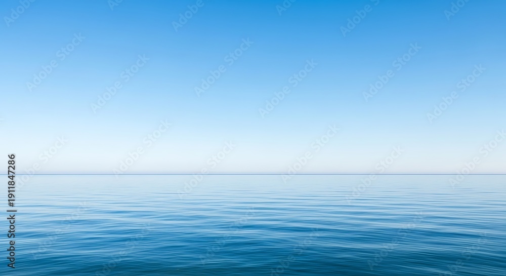 Fototapeta premium Serene seascape featuring a gradient of clear sky meeting the calming water