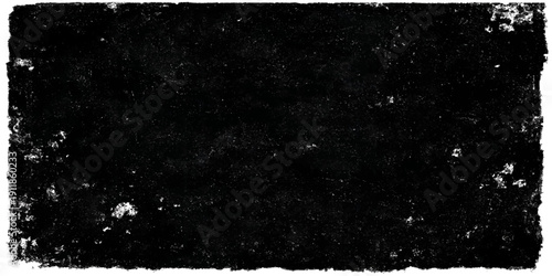 A dark and vintage black and white grunge background features a rough textured wall pattern with subtle light and grey space reminiscent of an old dirty film or a blank night sky