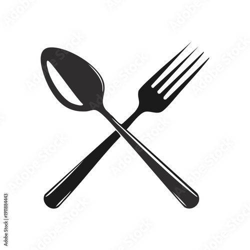 A set of silver kitchen silverware including a fork, spoon, and knife isolated on a white background as professional metal cutlery utensils for restaurant dining