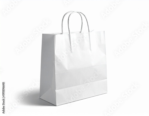 White paper shopping bag with twisted handles isolated on white