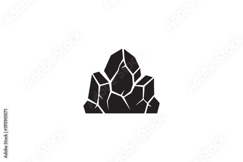 Group of cracked black stones resembling coal or dark minerals, symbolizing geology and raw materials