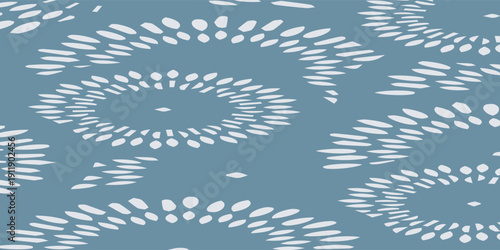 Abstract light patterns on a blue background creating a mesmerizing visual effect.