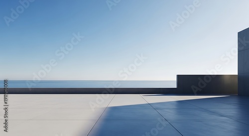 Modern terrace with ocean view under a clear blue sky.