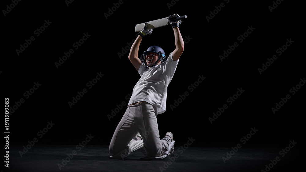 Foto Cricket player kneeling on dark background celebrating decisive win