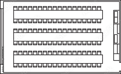 An overhead monochrome view of a classroom or conference hall arrangement, capturing a sense of structure, order, and potential for interaction and education.