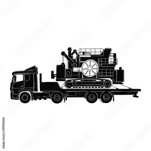 Heavy machinery transported on a lowboy trailer truck.