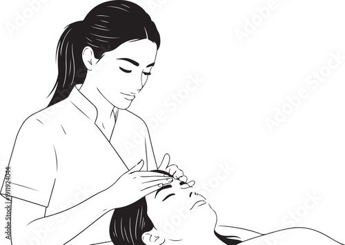 Woman receiving facial massage from therapist