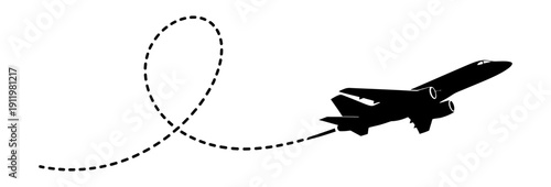 Silhouette of a Jet Airplane Performing a Loop de Loop Maneuver in the Sky